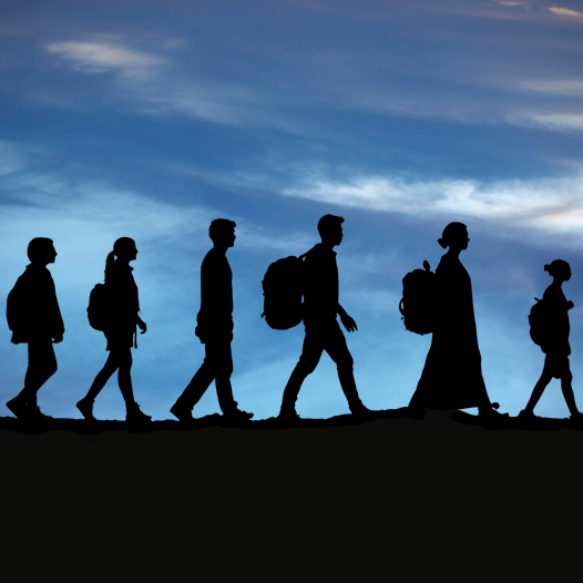 Silhouette of people walking with backpacks aided by immigration consultants in kerala